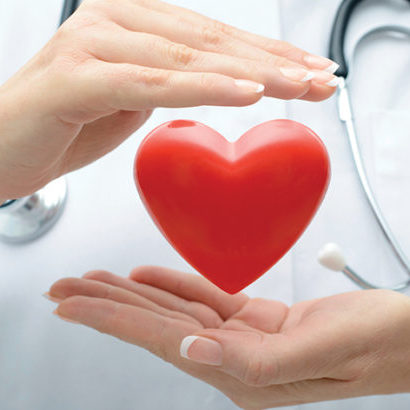 Doctor holding heart Female doctor with the stethoscope holding heart
